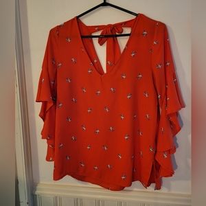 Bright coral orange blouse